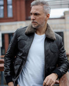 Black Fur Collar Leather Jacket with Embossed Patches