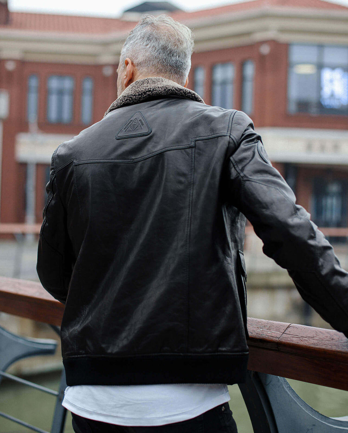Black Fur Collar Leather Jacket with Embossed Patches
